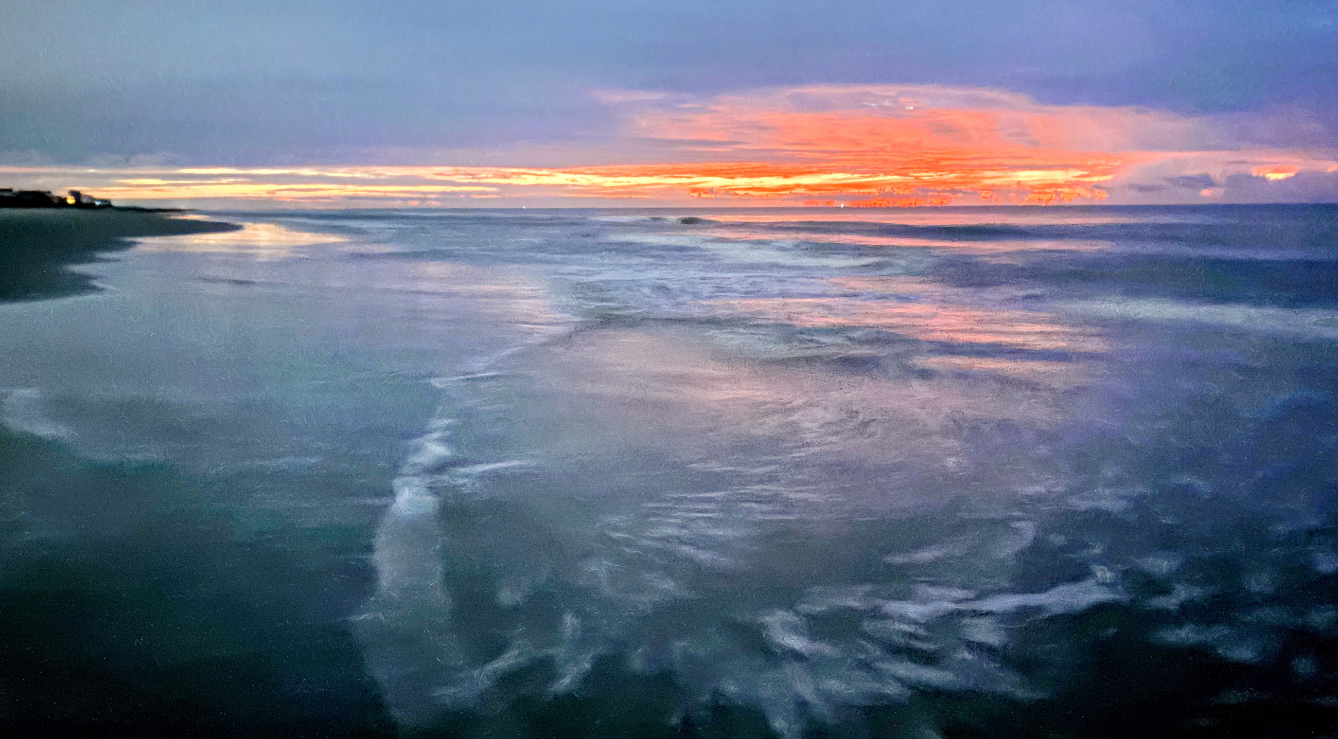 Rose-red first light spreads across a reflective shoreline under cool blue clouds